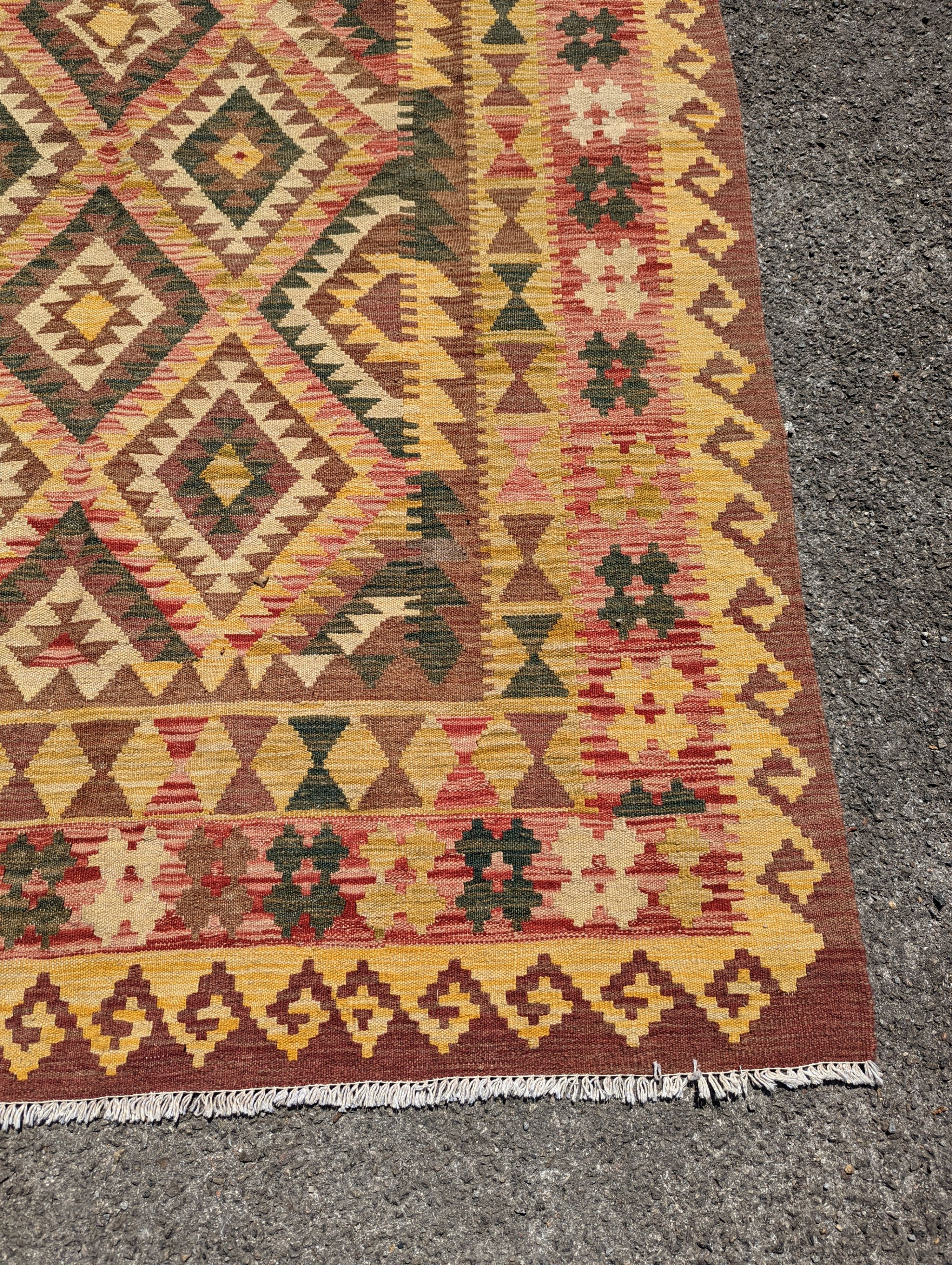 An Anatolian design polychrome geometric flatweave Kilim rug, 215 x 157cm